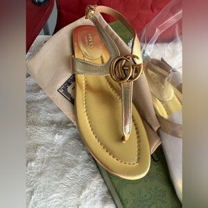 Beautiful never worn size 39 GG gold sandals. They were a gift and do not fit.